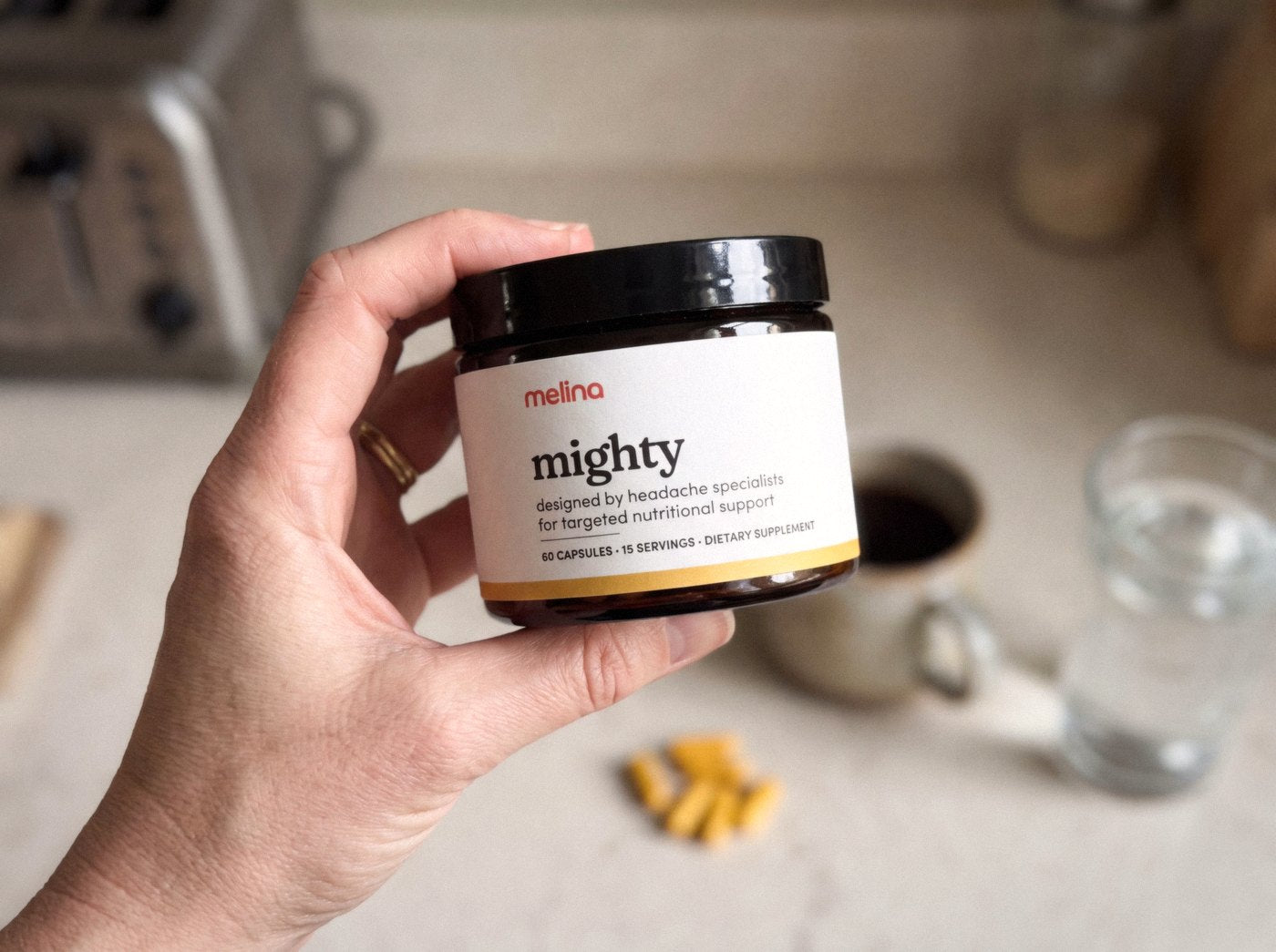 The Mighty jar in my hand, kitchen counter