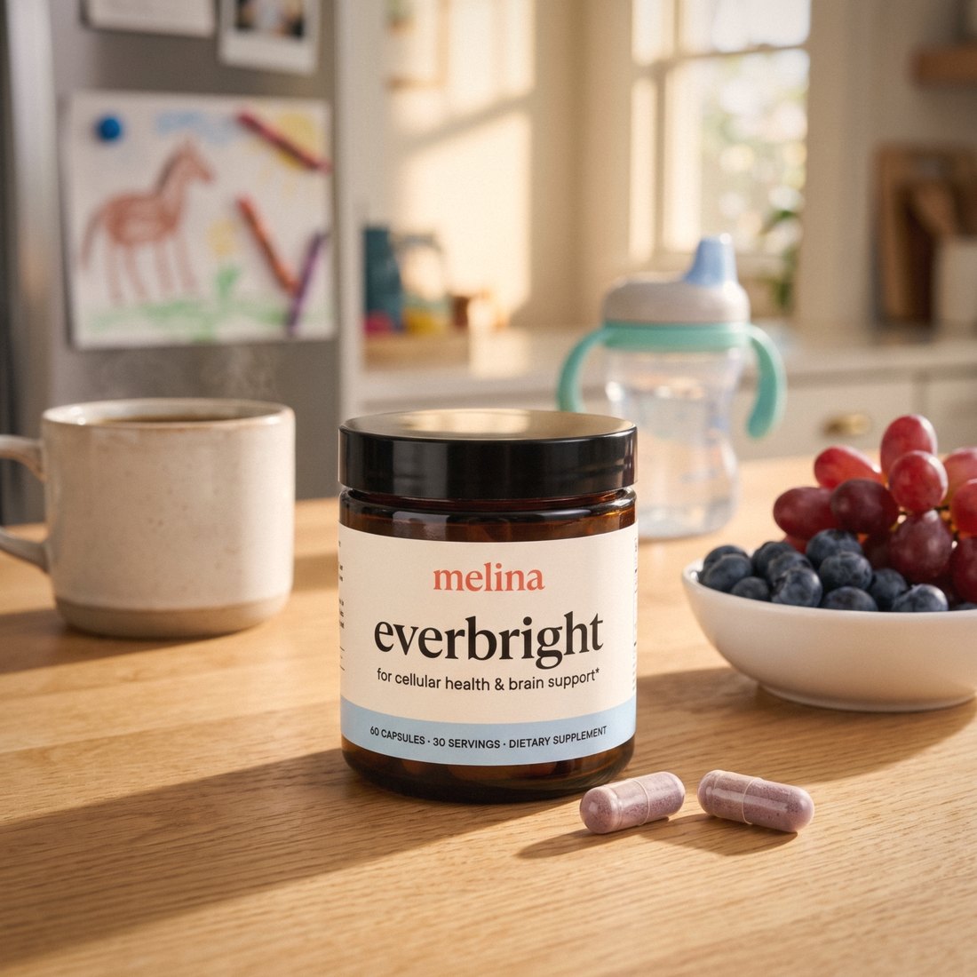 Everbright jar on a kitchen counter with blueberries and grapes